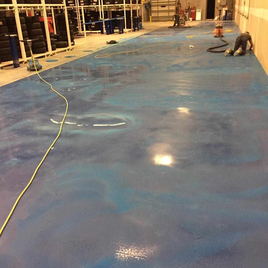 Technicians installing an outdoor AC condenser